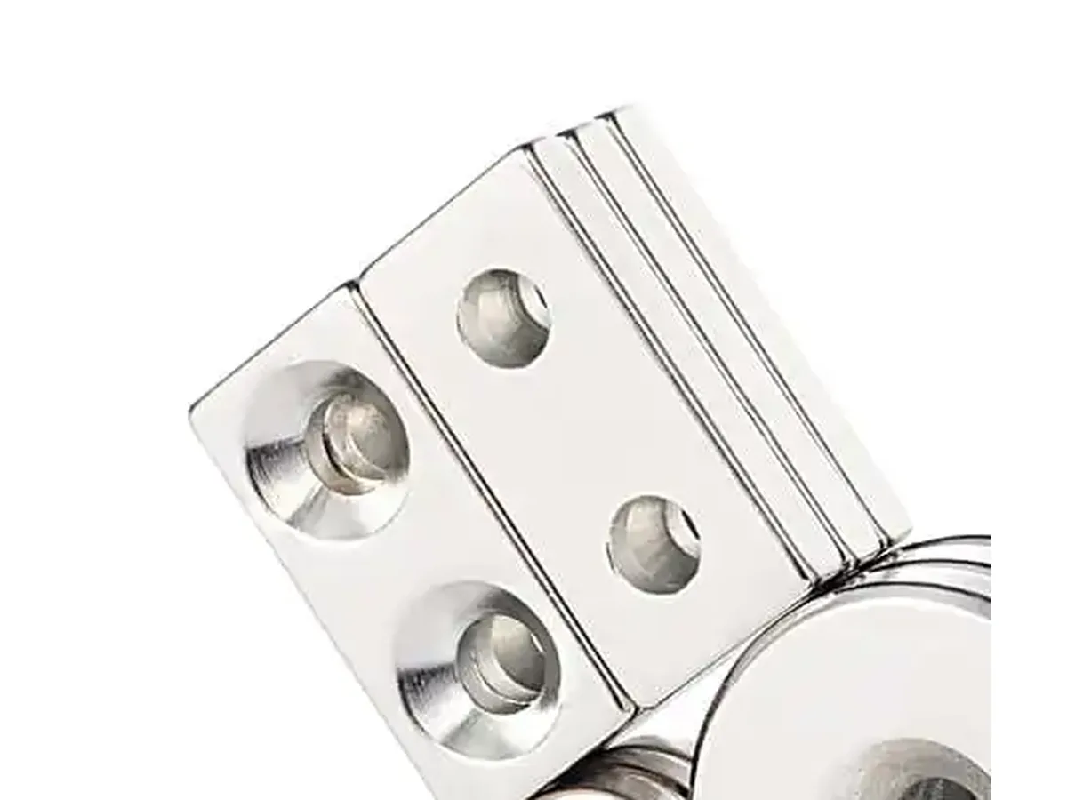 Close-up of countersunk holes on rectangular neodymium magnets