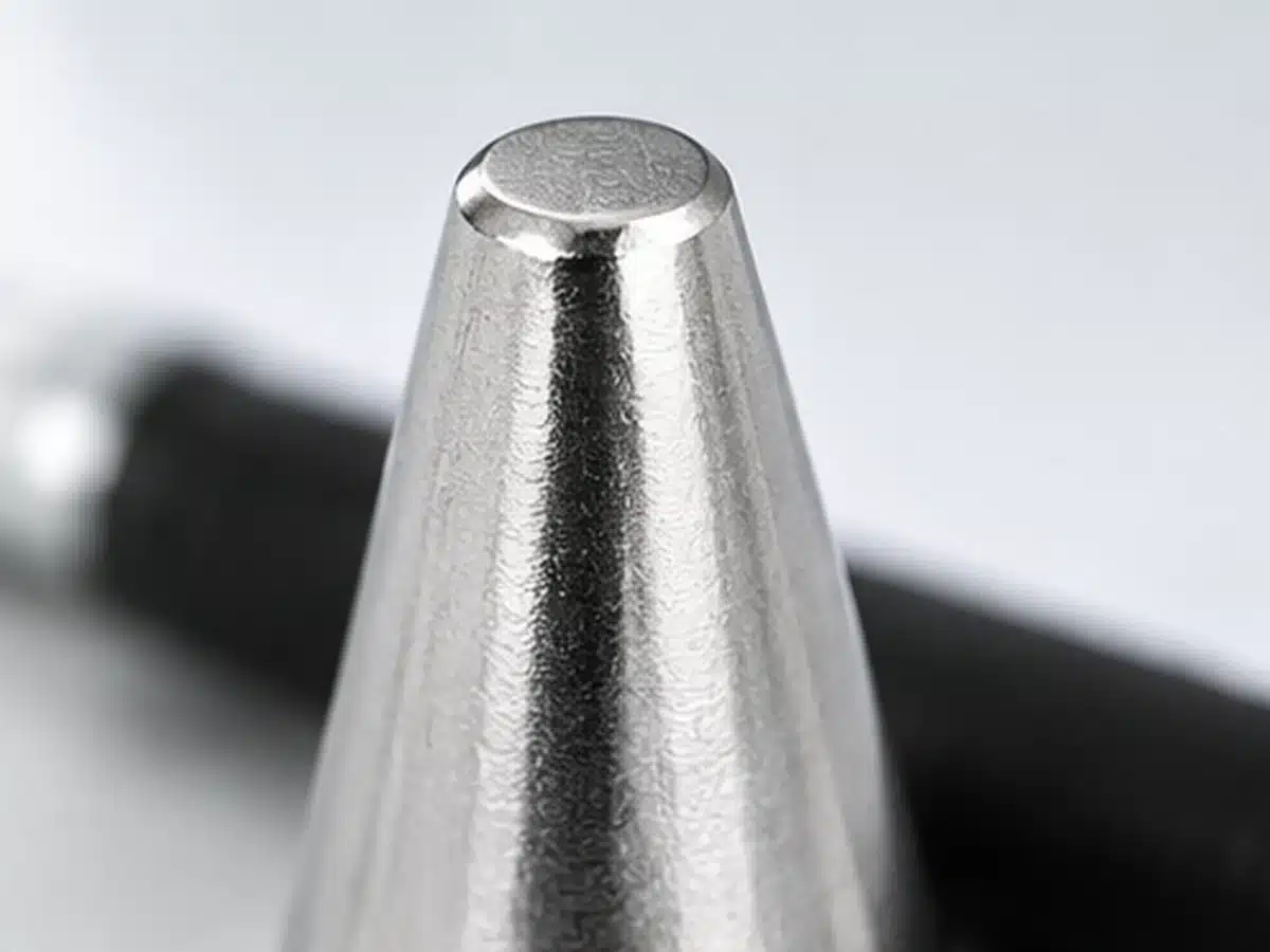 Close-up of the smaller flat tip face of a neodymium cone magnet