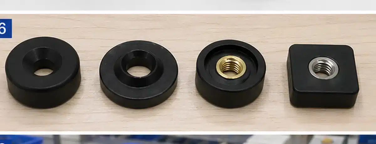 Illustrative countersunk holes and threaded inserts in plastic magnet assemblies