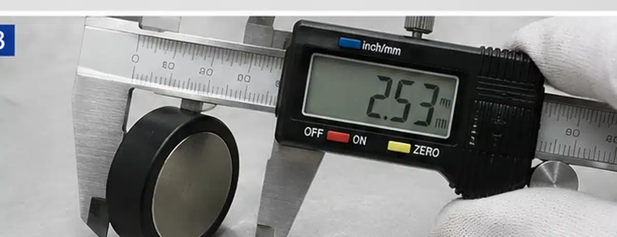 Illustrative measurement of plastic wall thickness on a magnet assembly